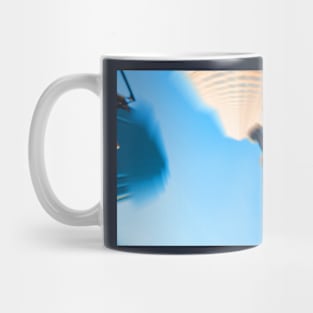 Conveying the pace and madness of big city life high-rise buildings spinning Mug